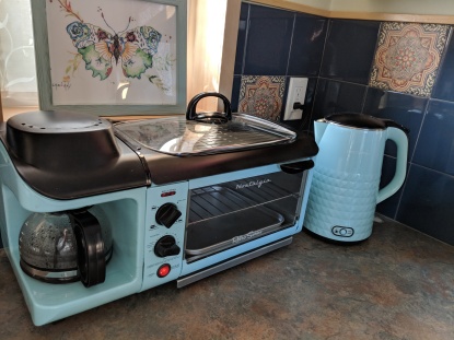 The kitchenette comes with a hot plate, coffee pot, toaster over, hot water heater, microwave and refrigerator/freezer for guests to warm up food.