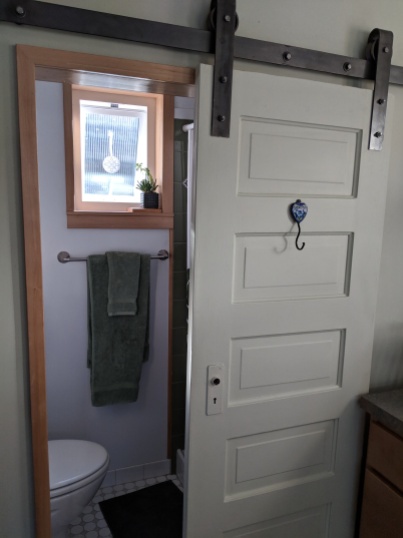 The door to the bathroom comes from Marc and Jeanine's 1911 house